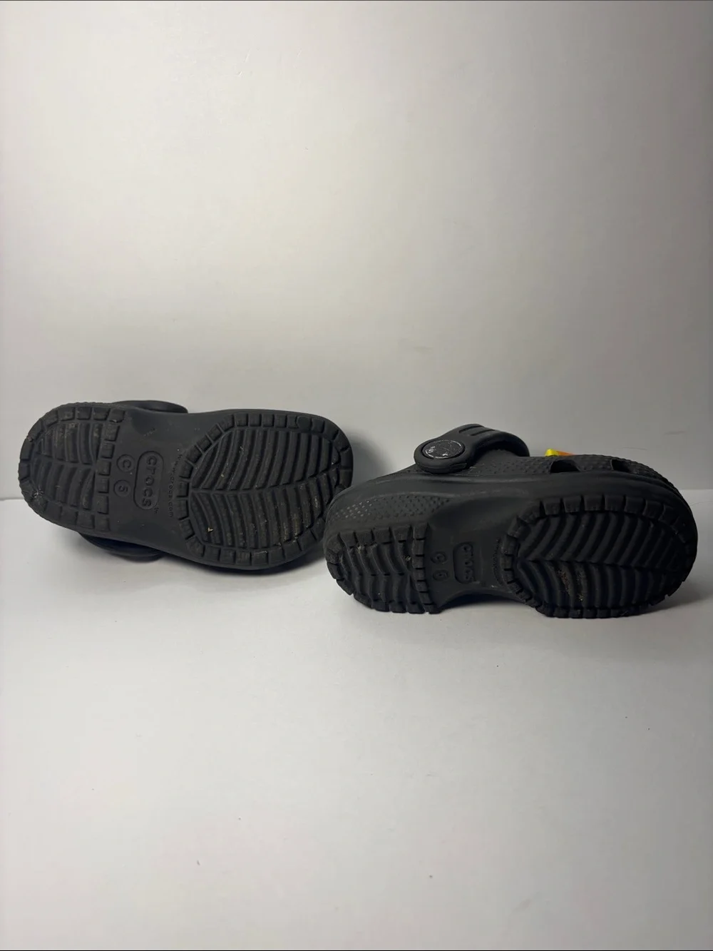CROCS Kids Black Clogs with Orange Accent Charm